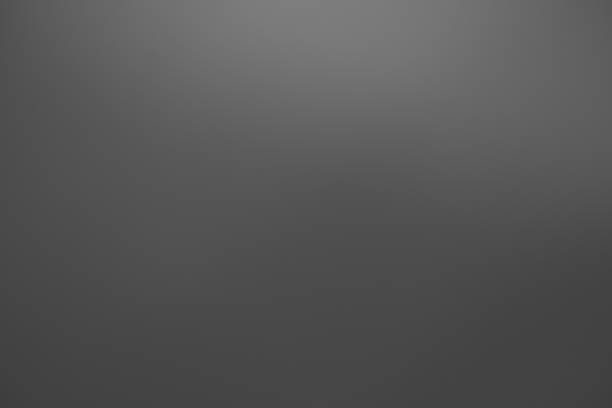 istock Dark black and gray blurred  gradient background has a little abstract light. 1403553817