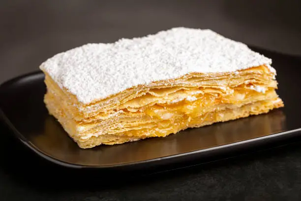 Mille feuille dessert on the plate.