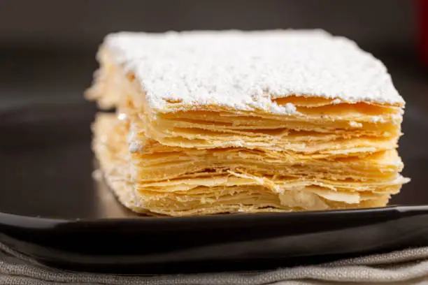 Mille feuille dessert on the plate.