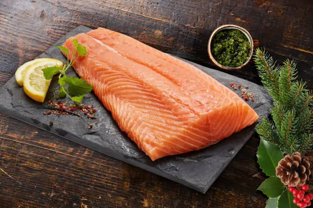 slice salmon fillet, tray rock on wood board background, object design, fresh foods seafood, nature healthy