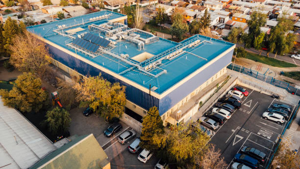 Aerial drone view of the architecture of a CESFAM Medical Center with a blue roof