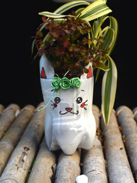 istock Vase made of plastic bottle with potted plant 1403582717