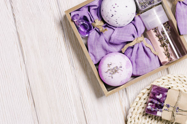 istock Products with lavender essential oil as handmade gift box, bath bombs, lavender spray and sachets on wooden table. Mindful gifting, natural aromatherapy cosmetics for body care 1403584711