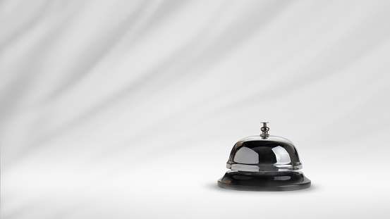 Bell on counter for service with fabric waving blurred background