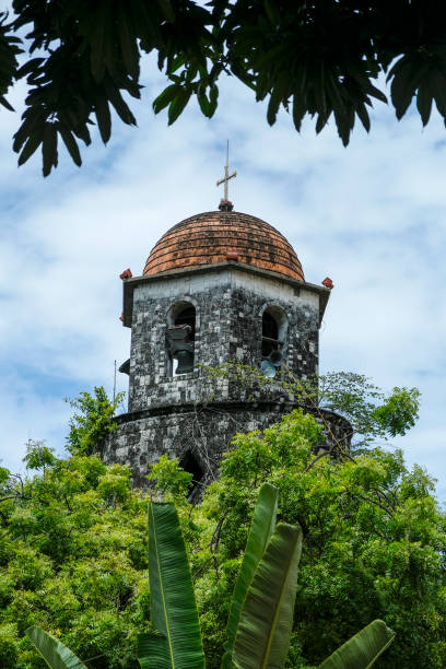 Dumaguete, Philippines - June 2022: Dumaguete Belfry in the Church of Santa Catalina de Alejandria in Dumaguete on June 17, 2022 in Negros Oriental, Philippines.
