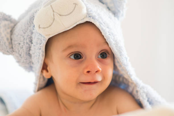 istock baby with towel on his head 1403600401