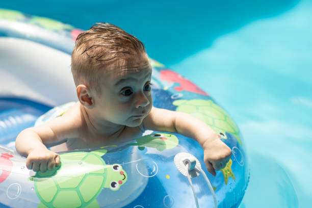 istock baby in the pool 1403600437
