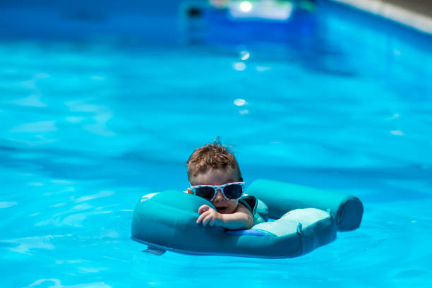 istock baby in the pool 1403600495