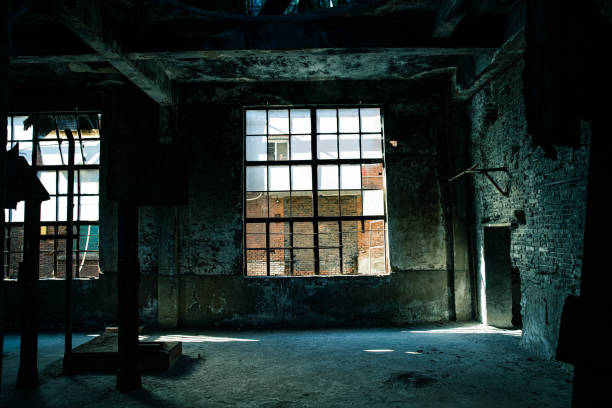 An old industrial building is illuminated by the sun.
