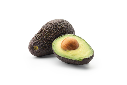 Set brown mature avocado whole, three quarters with bone, cut in half, slice isolated on white background. Clipping Path. Full depth of field.