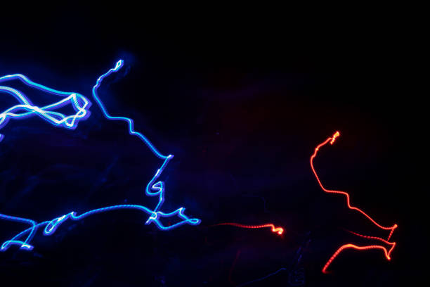 istock Chaotic lines in dark. Neon glow. Texture of bright lines. 1403604642