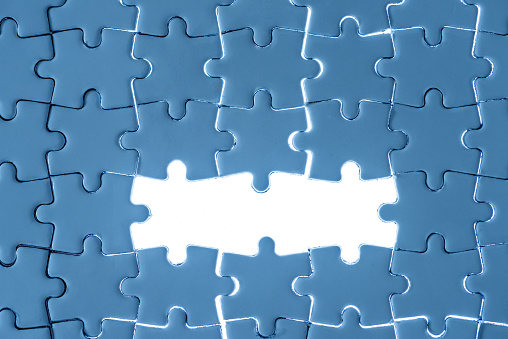 Blue puzzle background with three blank spaces