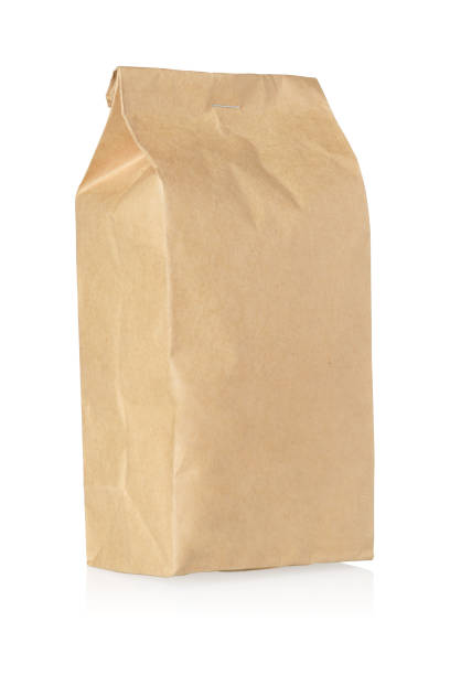 istock Brown craft paper bag isolated on white. 1403608310