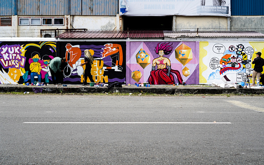 Banda Aceh, Indonesia - June 18, 2022:  22 mural art participants livened up the 76th Bhayangkara Day, in a mural competition held by the Aceh Regional Police