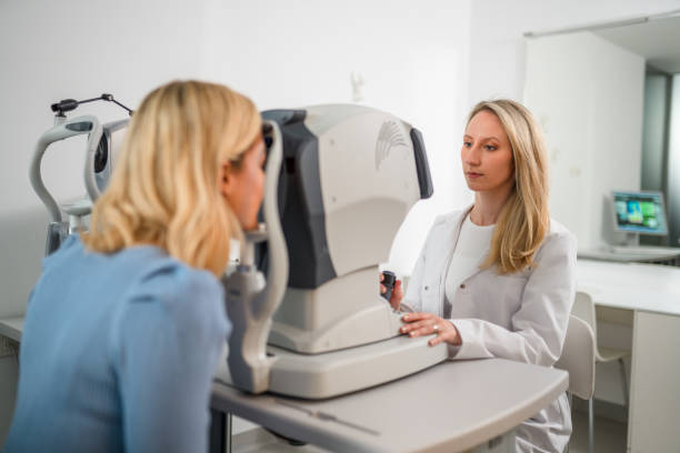 istock Female Young Ophthalmologist Examining Blond Patient 1403610240