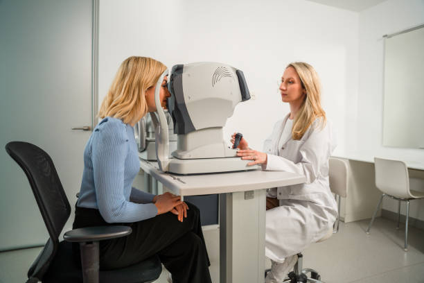 istock Attentive Eye Professional Analyzing Eye Up of a Blond Patient 1403610288