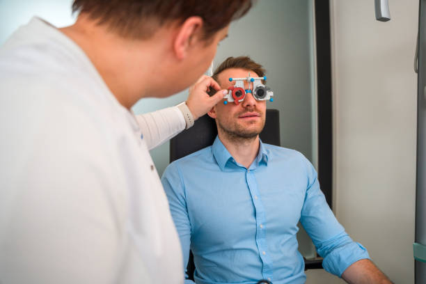 istock Male Mid Adult Patient Using Test Eyeglasses 1403610946