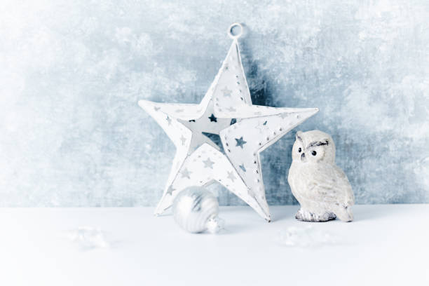 Christmas star on bright wooden background. Close up. Copy space.