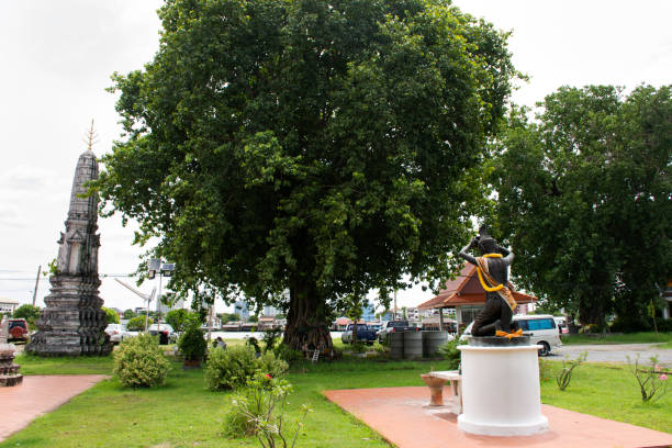 istock Ancient hermit or eremite statue with antique ruin stupa chedi for thai people traveler travel visit and respect praying blessing with holy mystery at Wat khien or Khian temple in Nonthaburi, Thailand 1403615743