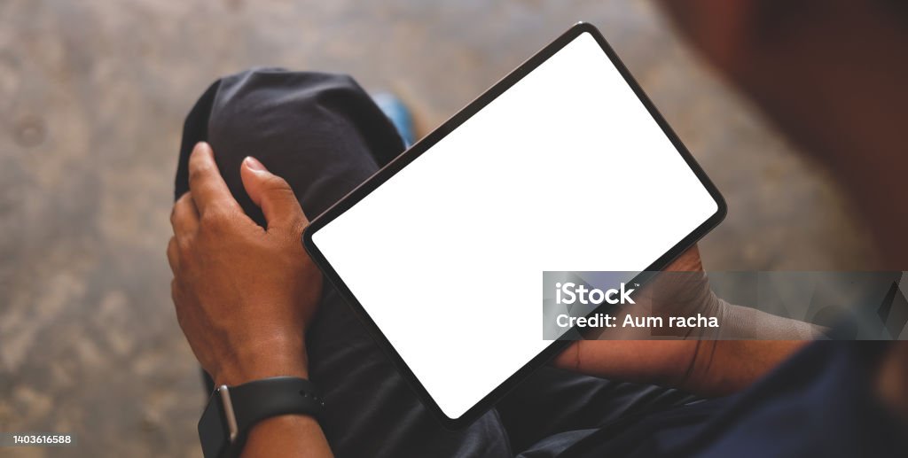 Man hands holding digital tablet with white screen. Digital Tablet Stock Photo