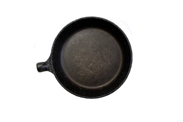 new iron skillet seen from above in white background