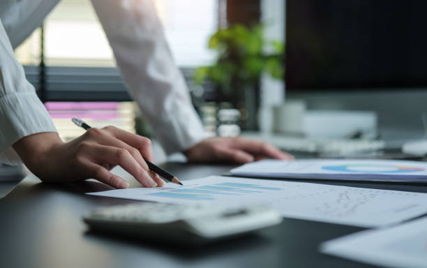 istock A young female administrative assistant making notes of working planning organizing information in her office.