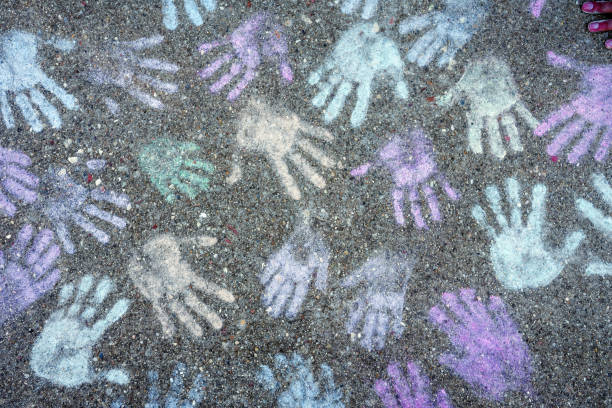 istock Background with colored hand prints on the playground 1403617651