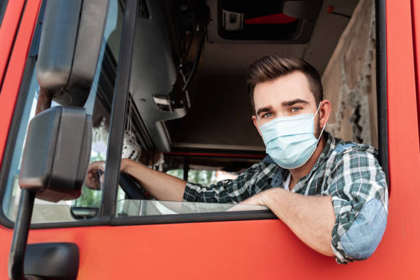 istock Young truck driver wearing protective face mask 1403618208