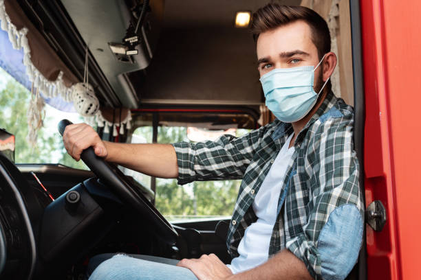 istock Young truck driver wearing protective mask 1403618272