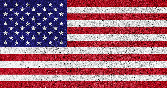 US national flag on a plastered wall