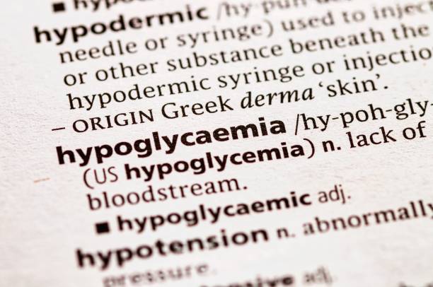 hypoglycemia Close up photo of the word hypoglycemia in a dictionary book hyperglycemia stock pictures, royalty-free photos & images