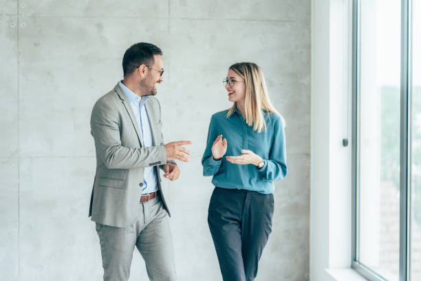 istock Two cheerful business people 1403621113