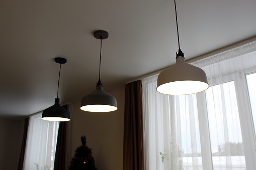 Three lamps hang from the ceiling.