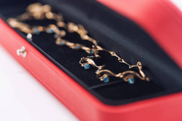 istock An elegant gold necklace with turquoise topaz lies inside gift box 1403625006