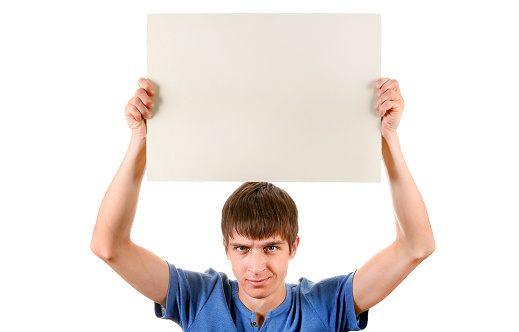 Annoyed Young Man with Blank Board Isolated on the White Background
