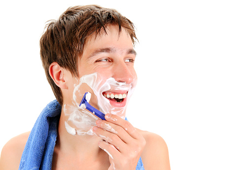 Happy Young Man shaving Isolated on the White Background closeup
