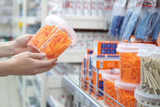 istock Human chooses corrugated plastic plugs in store of construction goods. 1403626146