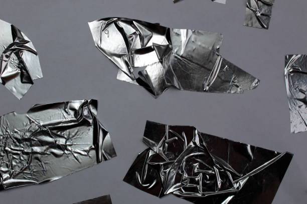 istock Abstract background silver adhesive tape glued in different ways. 1403626959