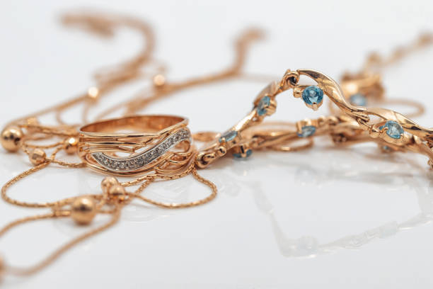 istock A gold chain with a pendant and a Topaz ring 1403627015