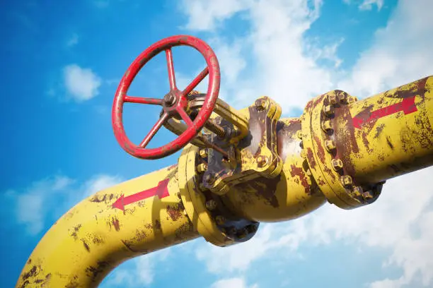 Photo of Rusty gas pipeline valve on sky background 3D