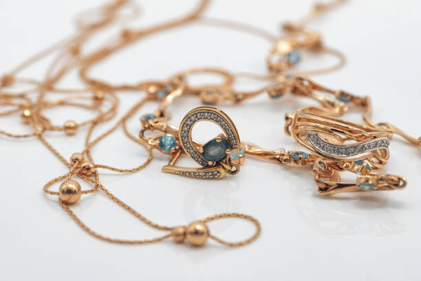 istock A gold chain with a pendant and a Topaz ring 1403627980