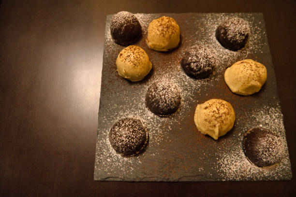 istock Dark and white chocolate bonbons filled with raspberry and coconut 1403631623