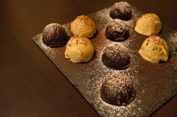 istock Dark and white chocolate bonbons filled with raspberry and coconut 1403631658