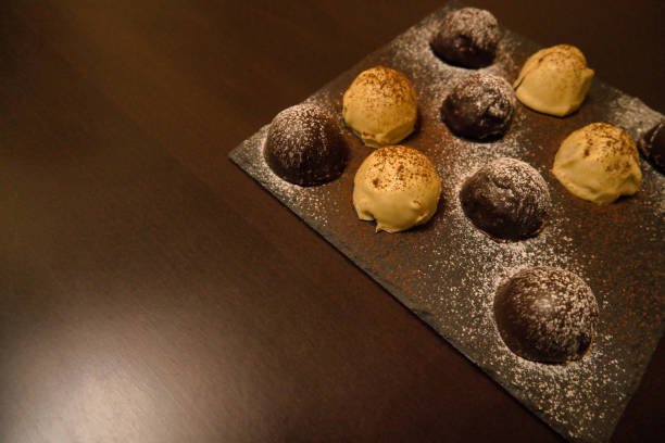 istock Dark and white chocolate bonbons filled with raspberry and coconut 1403631683