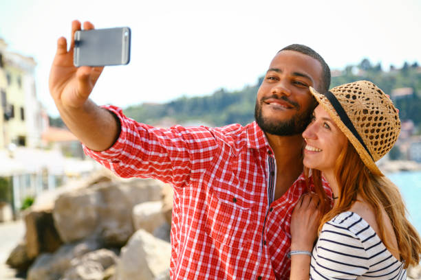 istock Tourists in a new city taking selfie 1403631945