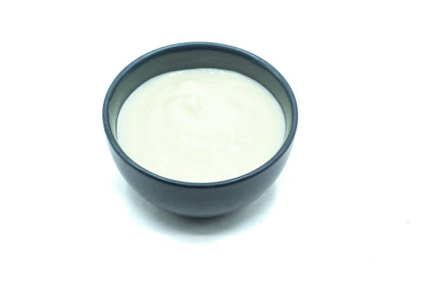 istock Yogurt in bowl isolated on white background 1403634405