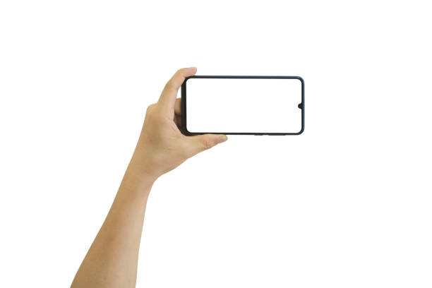 istock Male hand holding mobile smartphone with blank screen isolated on white background. clipping path include 1403635800