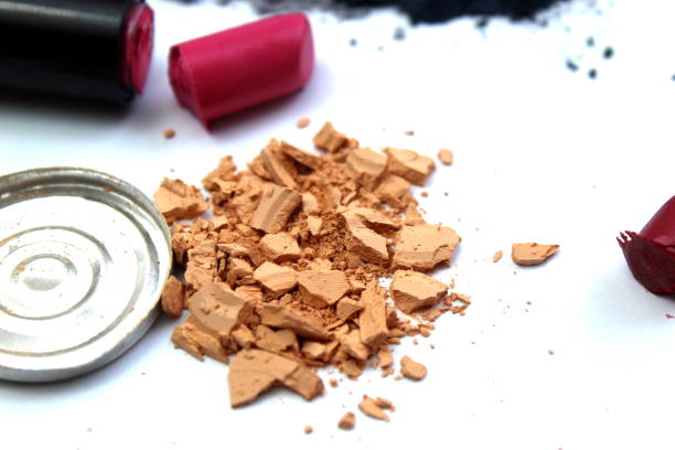 istock Different cosmetics, open, broken, scattered and spilled lies on a white background. 1403636162