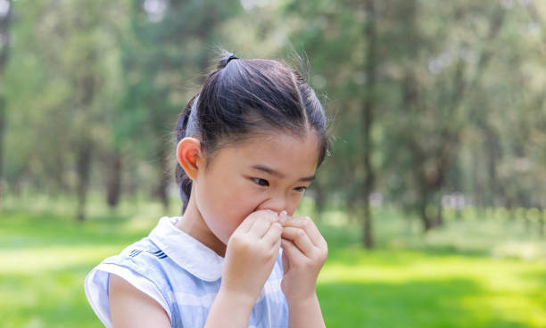istock Little Girl Wipe Nose 1403636376