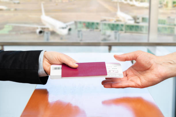 istock stewardess returning identification passport to passenger at boarding gate 1403637585